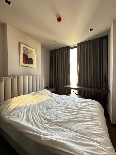 Cozy bedroom with modern decor and natural light