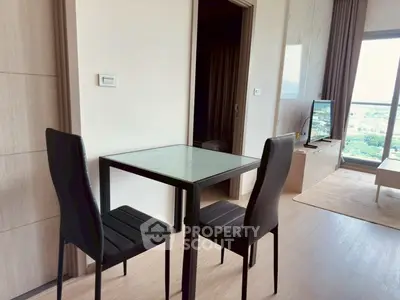Modern apartment interior with dining area and scenic window view