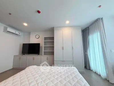 Modern bedroom with sleek furniture and natural light