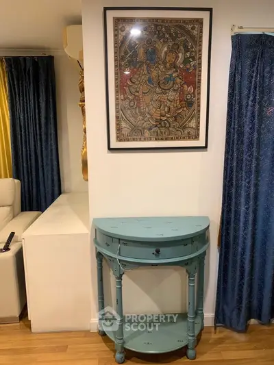 Stylish interior with elegant console table and framed artwork, perfect for modern living spaces.