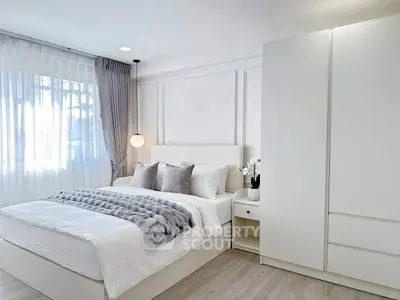 Elegant modern bedroom with natural light and stylish decor