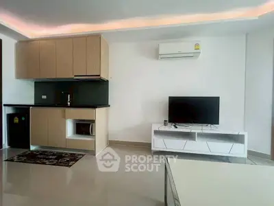 Modern living room with sleek kitchen and air conditioning unit