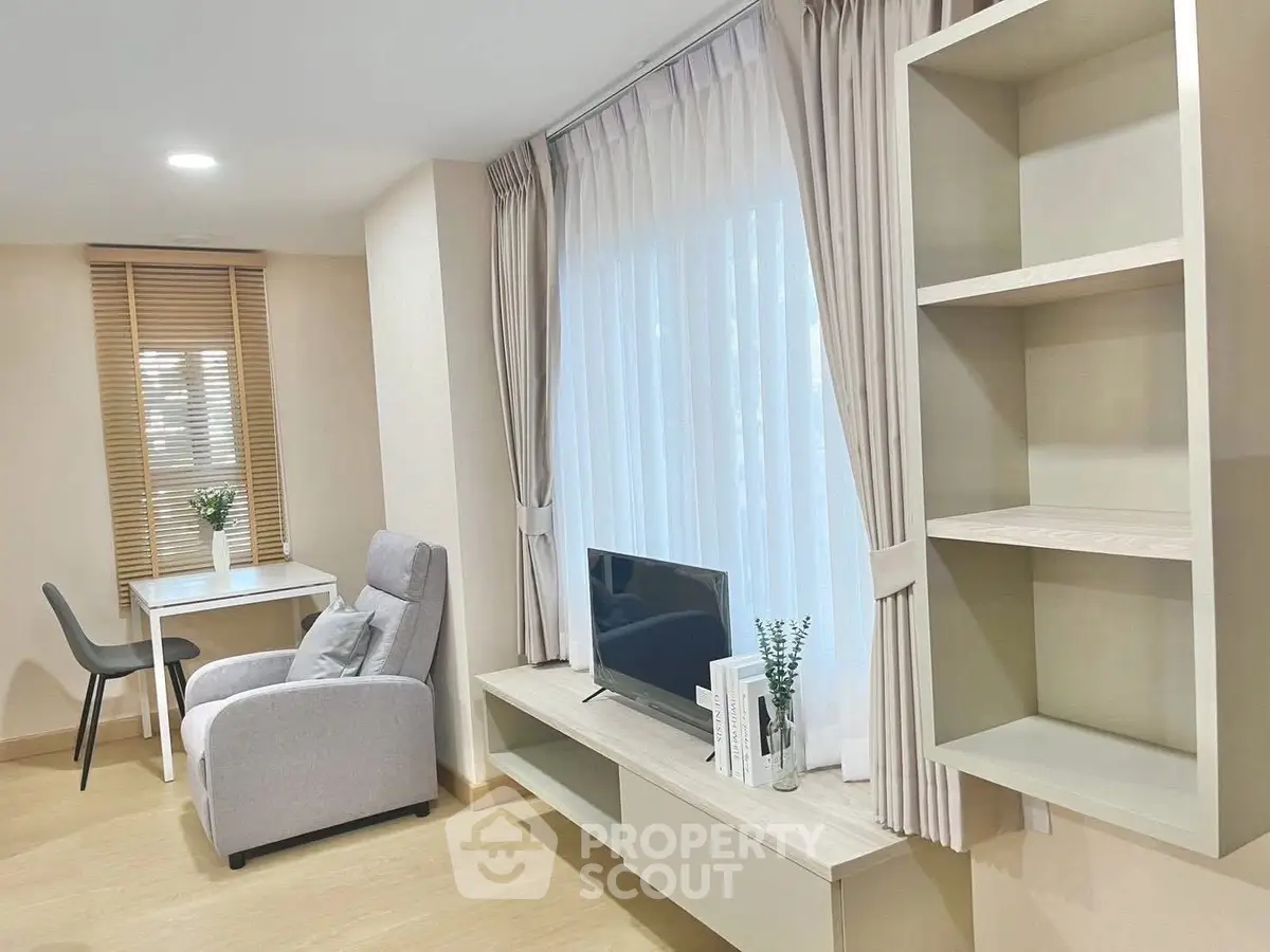 Modern living room with stylish furniture and natural light, perfect for relaxation and entertainment.