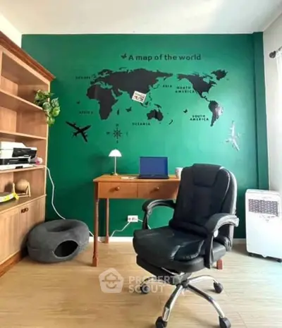 Stylish home office with world map wall decor and ergonomic chair
