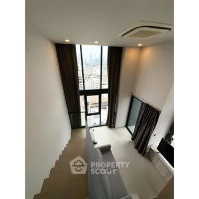 Modern loft apartment with high ceilings and panoramic city view