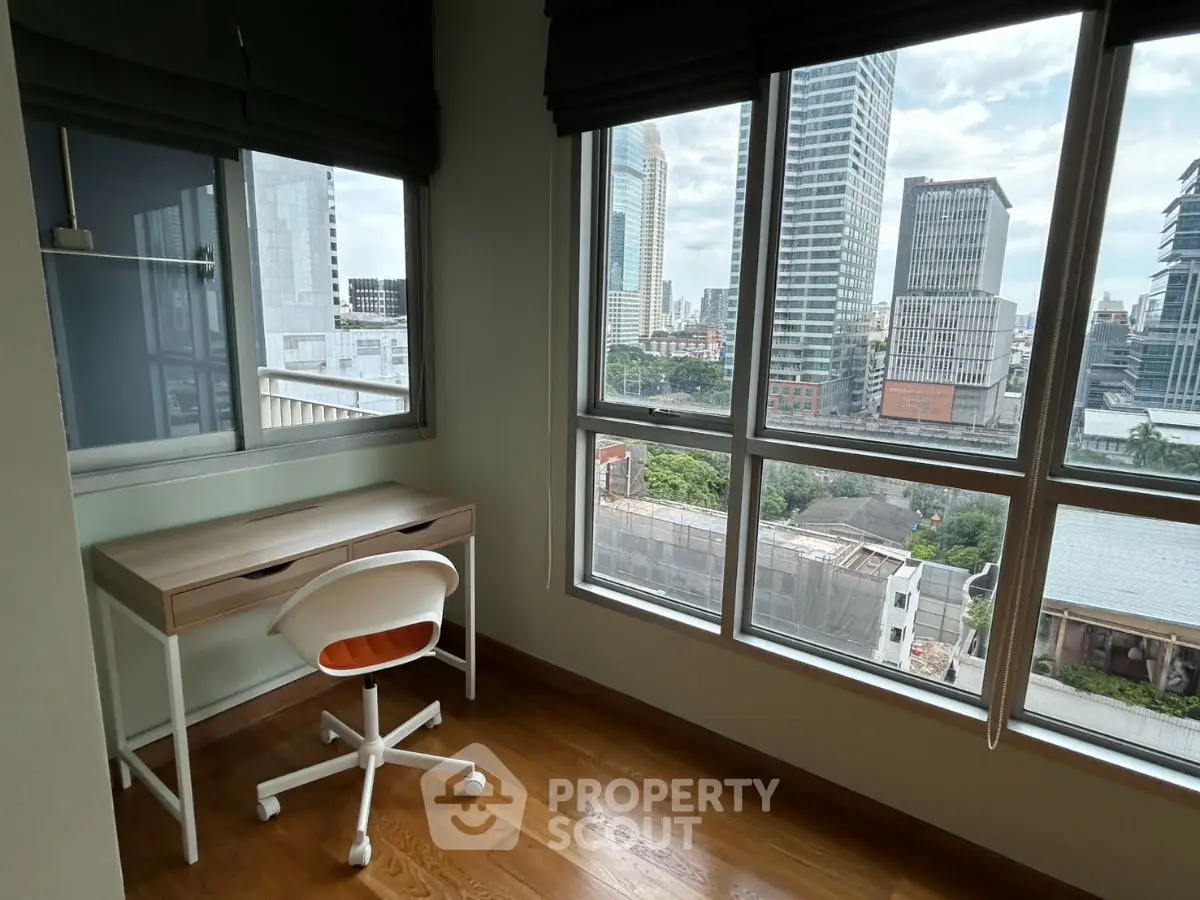 Bright study room with city view and modern desk setup