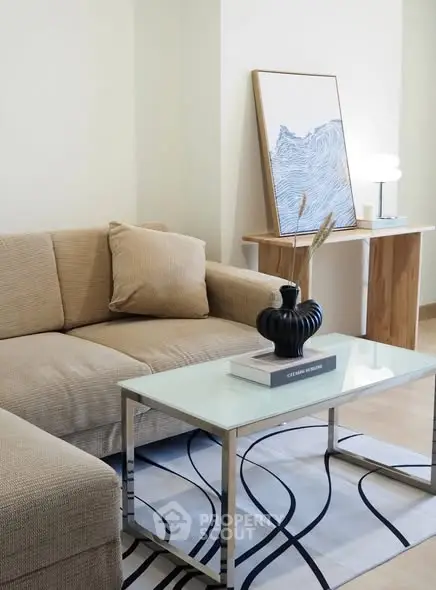 Modern living room with stylish decor and cozy beige sofa, perfect for relaxation and entertaining.