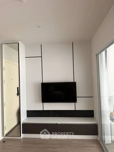 Modern living room with sleek TV setup and minimalist design