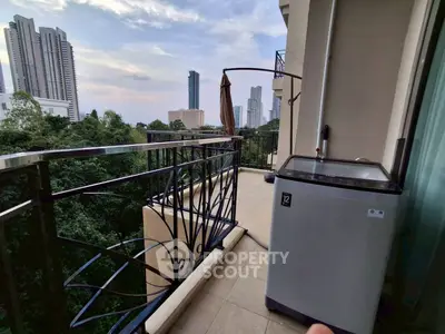 Spacious balcony with washing machine and stunning city view