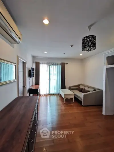 Spacious living room with modern decor and natural light