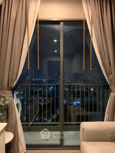 Stunning city view from a cozy balcony at night, perfect for relaxation.