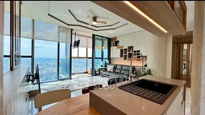 Luxurious open-plan living room with stunning city view and modern kitchen design.