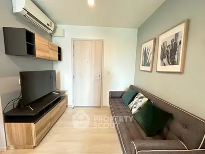 Modern living room with sleek furniture and stylish decor in a cozy apartment.