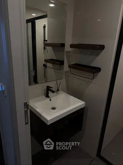 Modern bathroom with sleek sink and mirror design