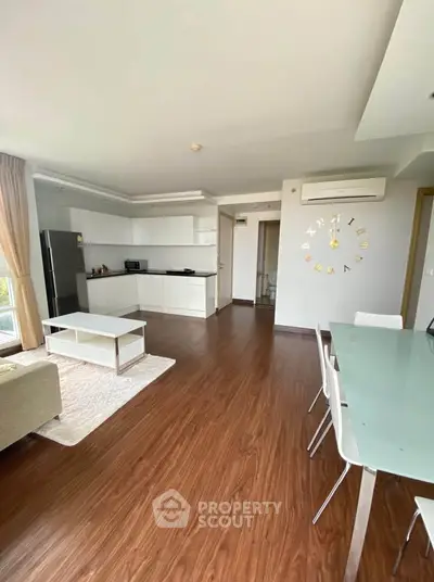 Spacious modern living room with open kitchen and stylish decor