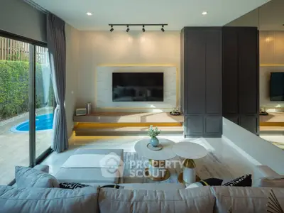 Luxurious living room with pool view, modern decor, and elegant furniture in a stylish home.