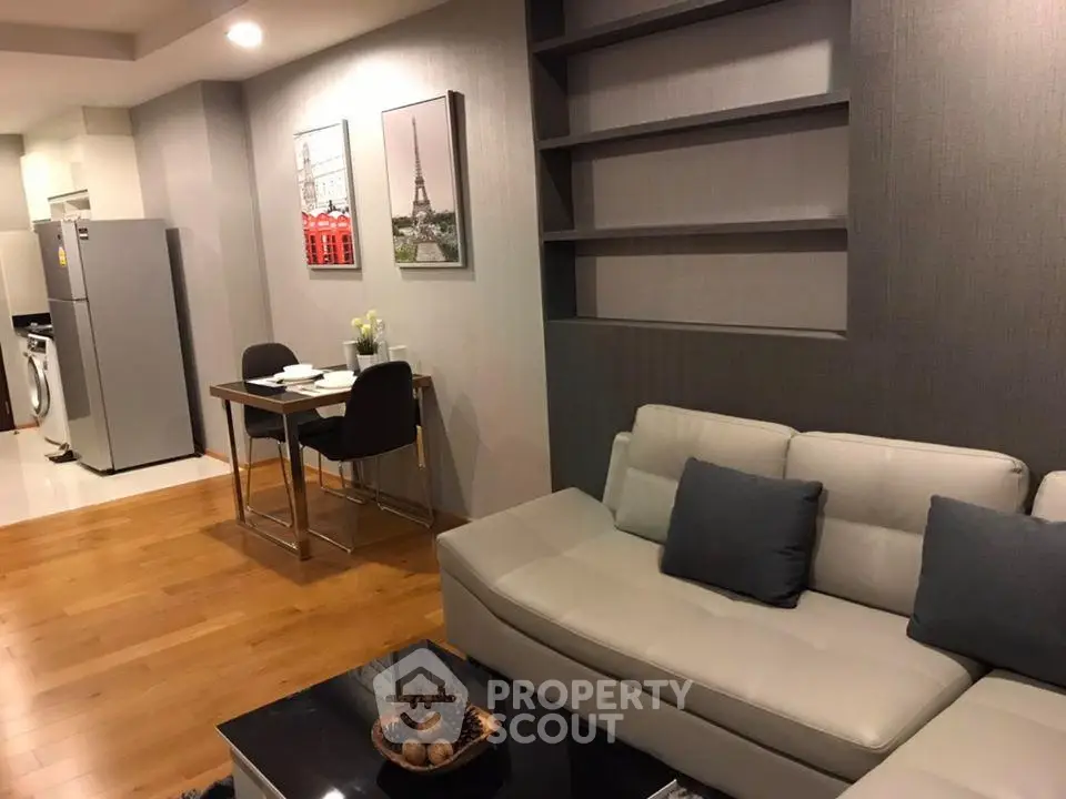 Modern living room with sleek design, featuring a cozy sofa and stylish dining area, perfect for urban living.