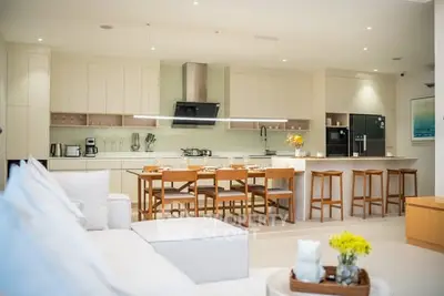 Spacious modern kitchen with open layout and stylish dining area