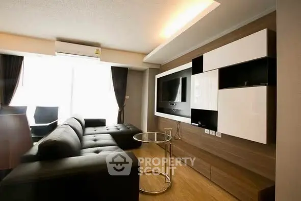 Modern living room with sleek furniture and stylish entertainment center