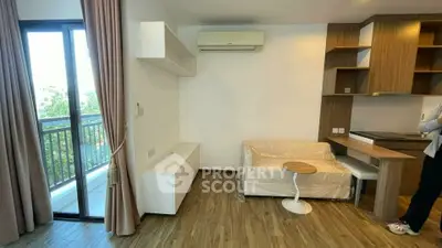 Modern living room with balcony access and stylish wooden flooring