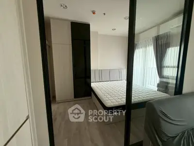 Modern bedroom with sleek design and large window for natural light