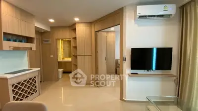 Modern living room with built-in wooden cabinetry and wall-mounted TV