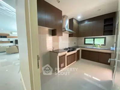 Modern kitchen with sleek cabinetry and gas stove in open layout design