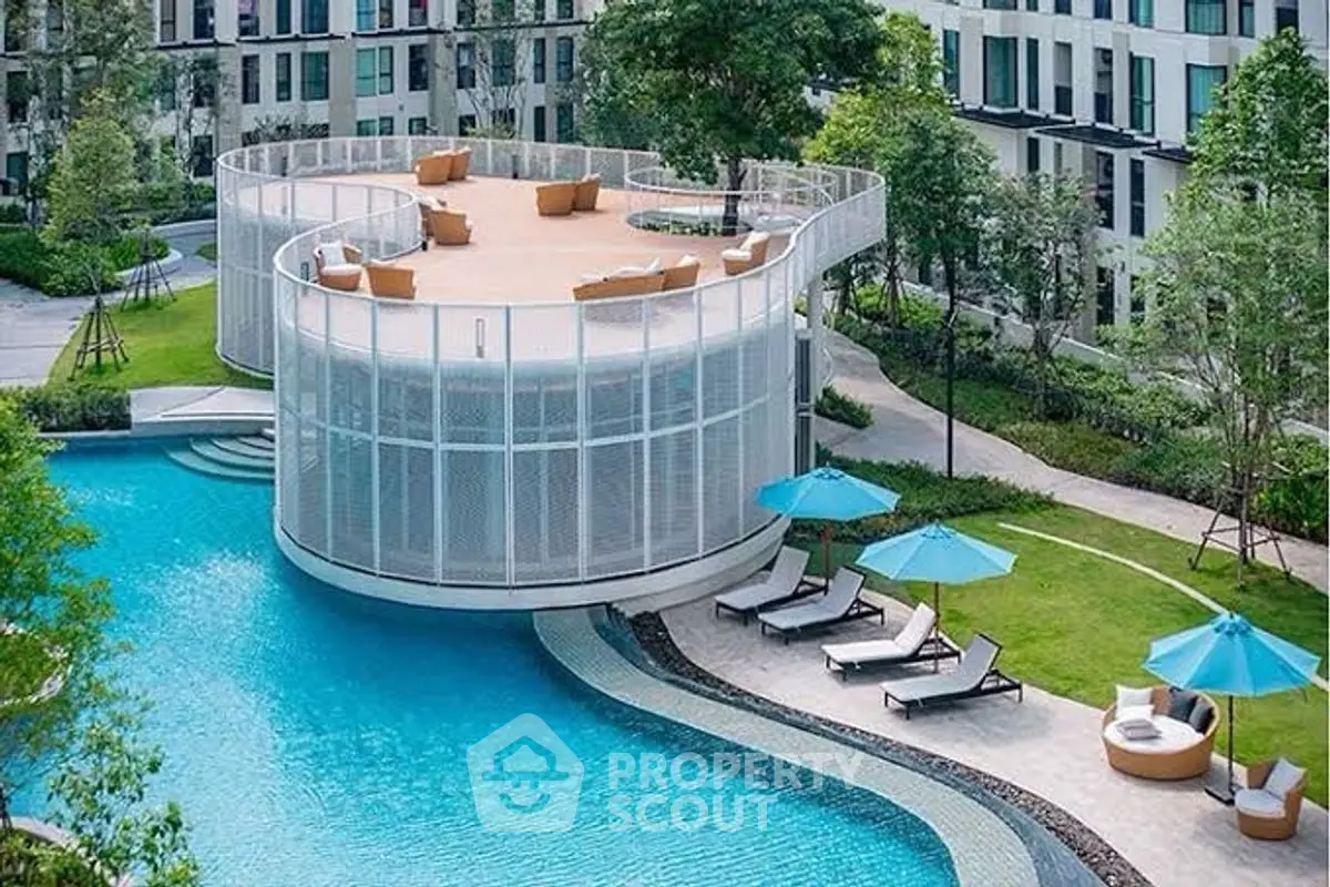 Luxurious modern apartment complex with stunning pool and rooftop terrace.