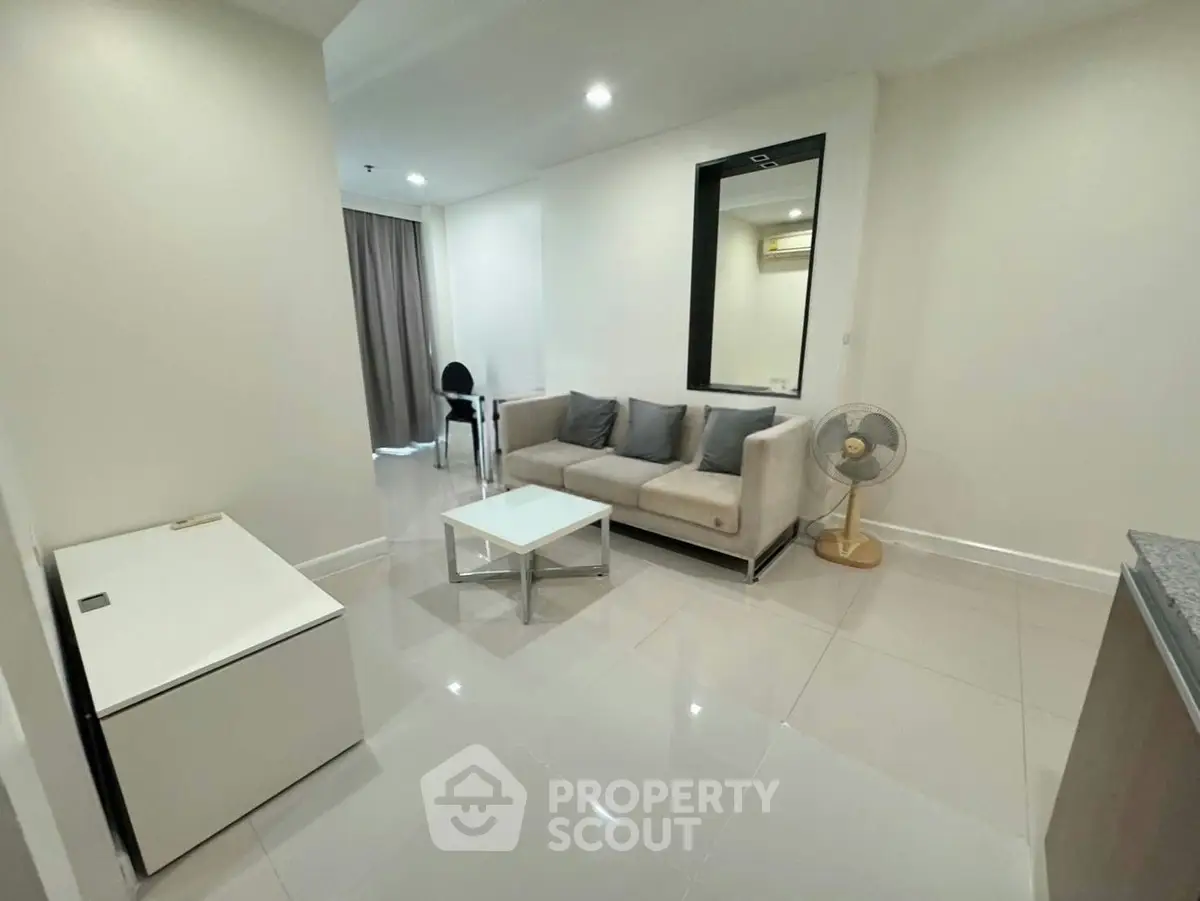 Modern living room with sleek furniture and neutral tones, perfect for urban living.