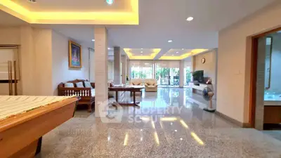 Spacious open-plan living area with modern decor and ample natural light.
