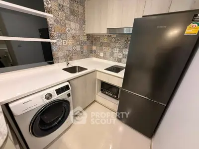 Modern kitchen with sleek appliances and stylish backsplash tiles