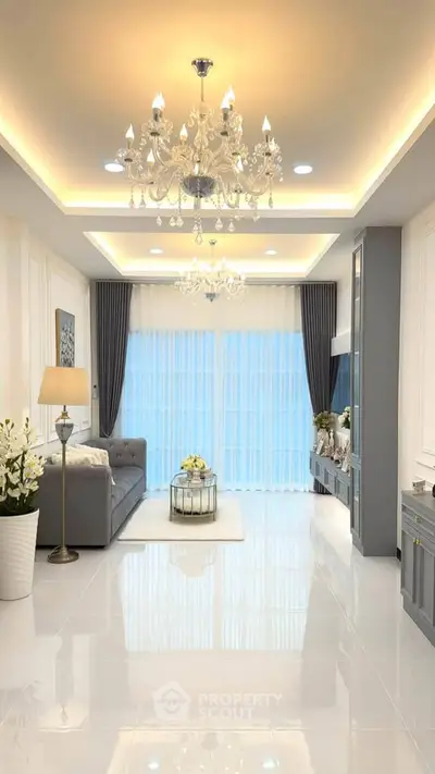 Luxurious living room with elegant chandeliers and modern decor