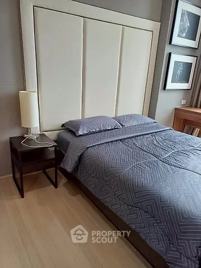 Modern bedroom with stylish decor and elegant headboard