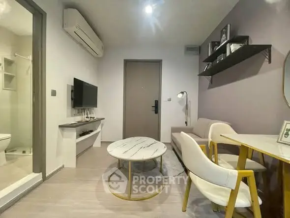 Modern living room with stylish furniture and air conditioning, perfect for cozy urban living.