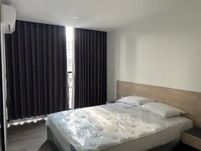 Modern bedroom with natural light and stylish decor