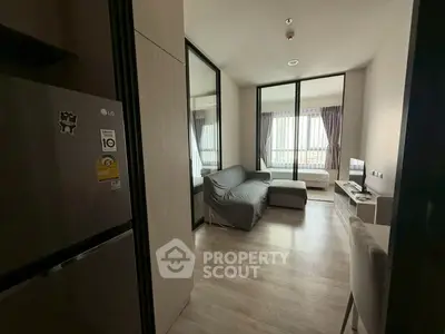 Modern apartment interior with cozy living room and bedroom, featuring sleek design and natural light.