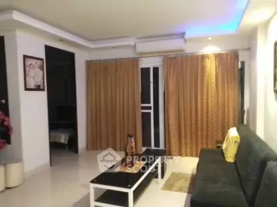 Spacious living room with modern decor and ambient lighting