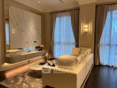 Luxurious living room with elegant decor and large windows, featuring a plush sofa and stylish lighting.