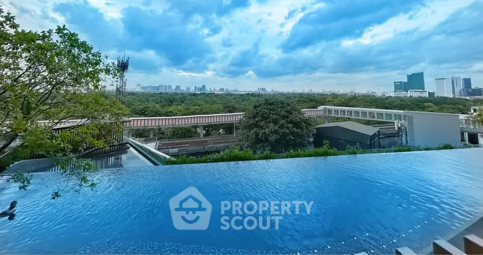 Stunning rooftop infinity pool with panoramic city skyline view