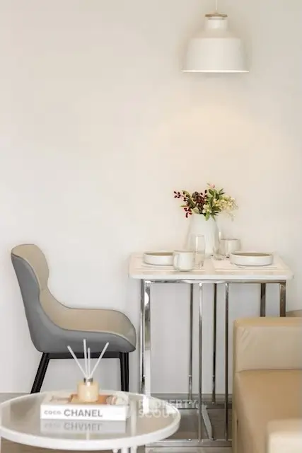 Modern dining area with elegant decor and stylish seating in a contemporary apartment.