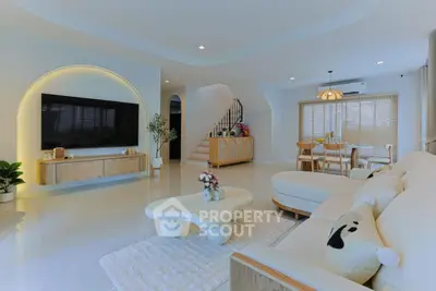 Spacious modern living room with elegant decor and open dining area