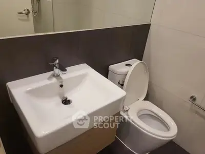 Modern bathroom with sleek fixtures and minimalist design.