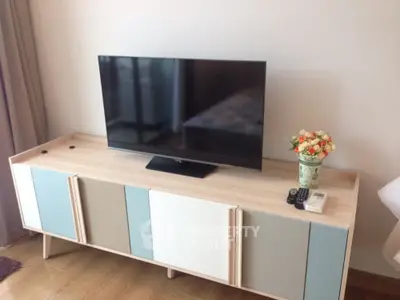 Modern living room with stylish TV stand and flat-screen TV