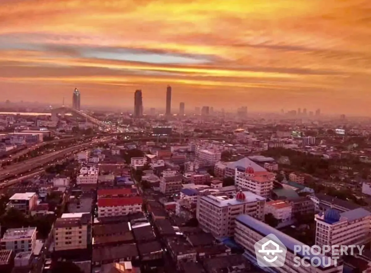 Stunning cityscape view at sunset with vibrant sky over urban skyline