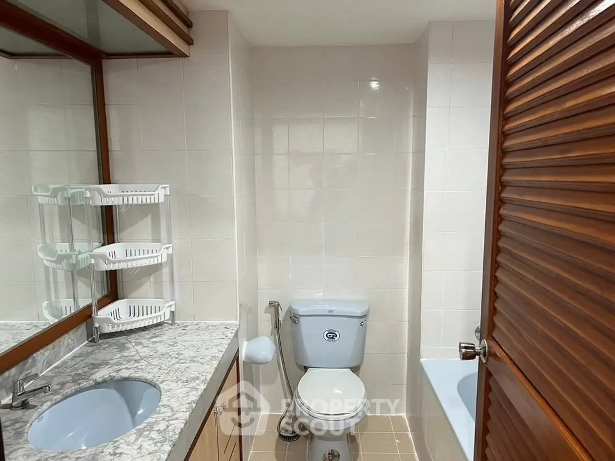 Spacious bathroom with modern fixtures and elegant marble countertop