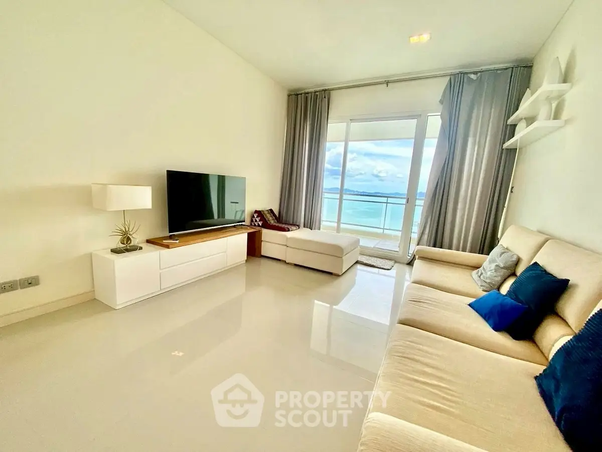 Spacious living room with ocean view and modern furnishings