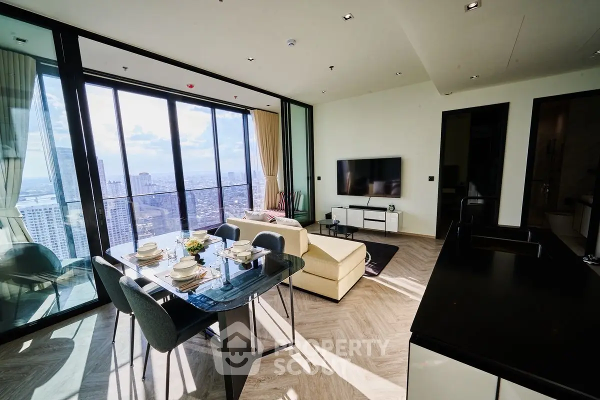 Luxurious high-rise living room with panoramic city views and modern decor.