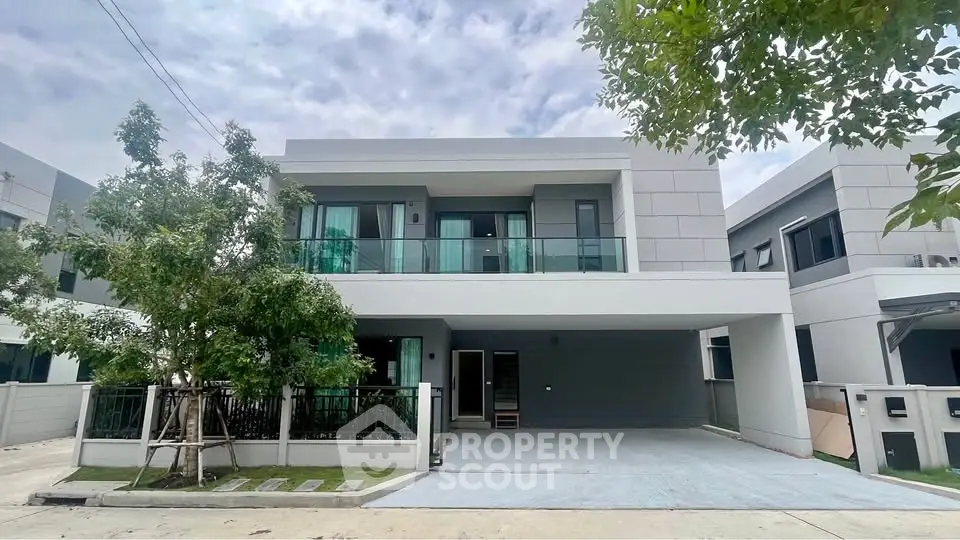 Modern two-story house with sleek design and spacious driveway