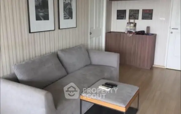 Cozy living room with modern gray sofa and stylish decor