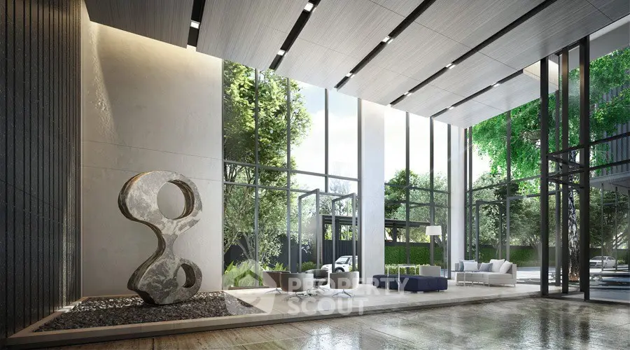 Luxurious modern lobby with floor-to-ceiling windows and stylish sculpture, offering a serene ambiance.